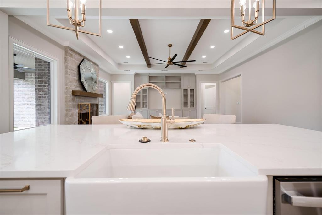 8005 Bee Cave Road China Spring, TX 76633 - Photo 39 of 40 Kitchen featuring a chandelier, open floor plan, recessed lighting, a fireplace, and stainless steel dishwasher