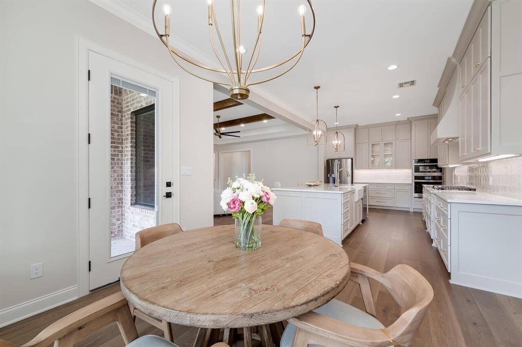 8005 Bee Cave Road China Spring, TX 76633 - Photo 19 of 40 Dining room featuring a chandelier, wood finished floors, beamed ceiling, recessed lighting, and ceiling fan