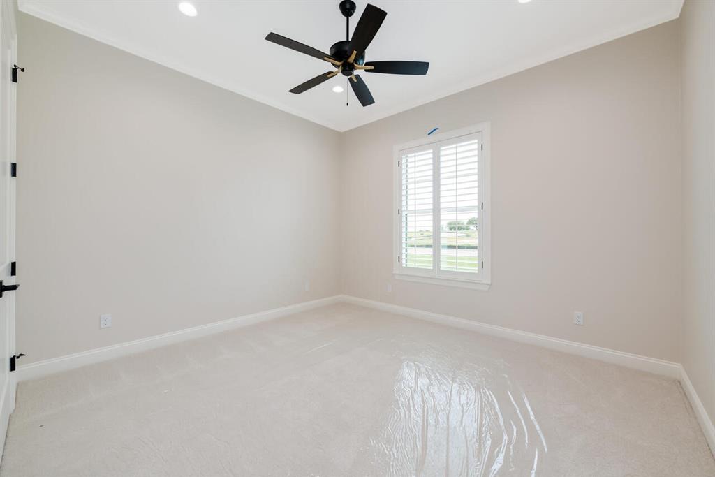 8005 Bee Cave Road China Spring, TX 76633 - Photo 30 of 40 Unfurnished room with light colored carpet, recessed lighting, ceiling fan, and ornamental molding
