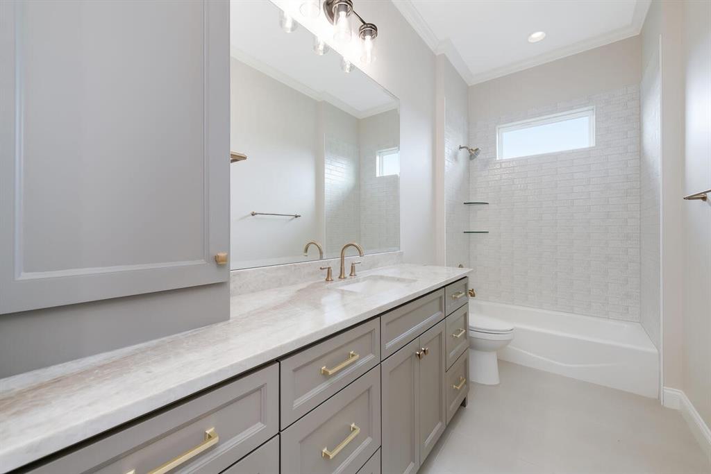 8005 Bee Cave Road China Spring, TX 76633 - Photo 31 of 40 Full bath featuring vanity, shower / tub combination, and ornamental molding