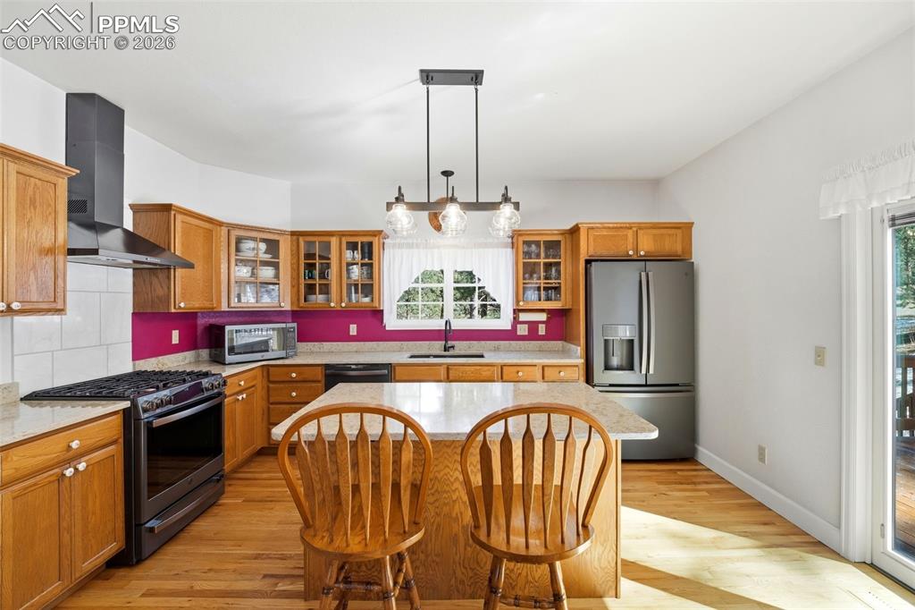 8795 Moss Rock Road Colorado Springs, CO 80908 - Photo 12 of 47 Gas Range with Hood Vent