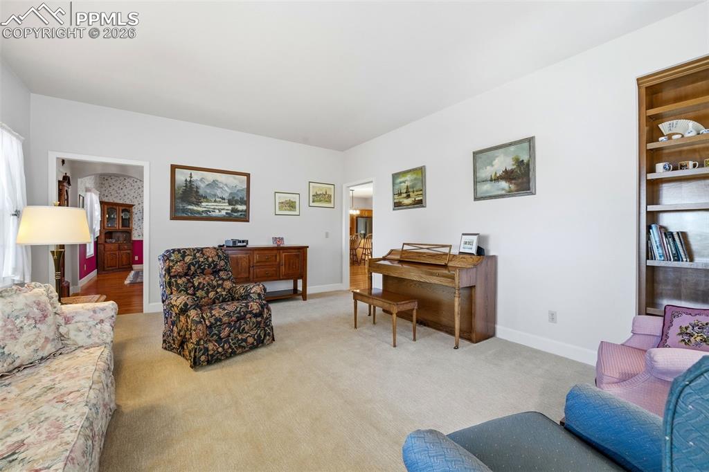 8795 Moss Rock Road Colorado Springs, CO 80908 - Photo 17 of 47 Living Room with Bookshelf