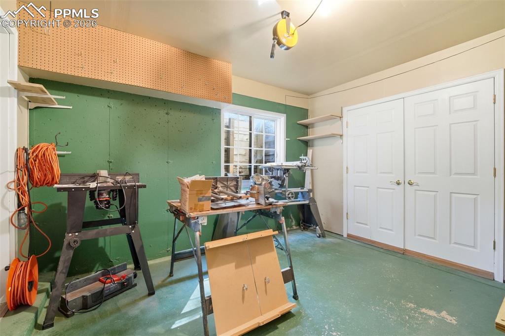 8795 Moss Rock Road Colorado Springs, CO 80908 - Photo 35 of 47 One Side of Workshop (Converted 3rd Garage Bay)