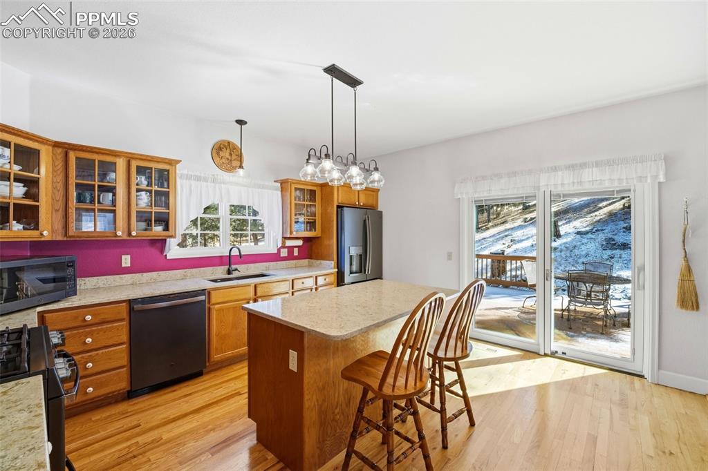 8795 Moss Rock Road Colorado Springs, CO 80908 - Photo 10 of 47 Kitchen walks out to Back Deck