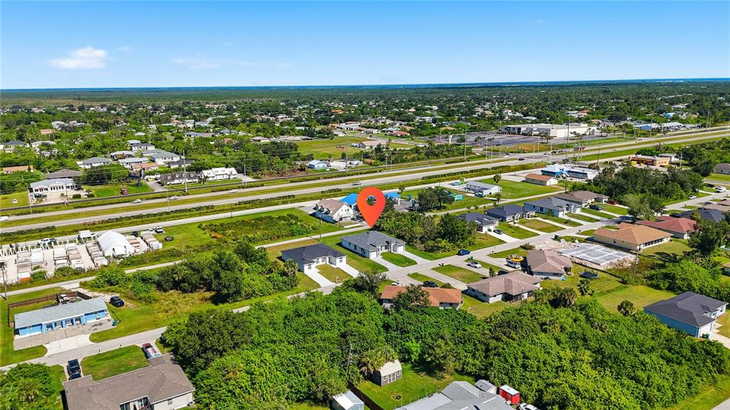 10458 Pendleton Avenue Englewood, FL 34224 - Photo 16 of 30 an aerial view of residential houses with outdoor space and ocean view
