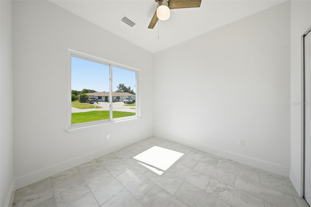 10458 Pendleton Avenue Englewood, FL 34224 - Photo 19 of 30 a view of an empty room and a window
