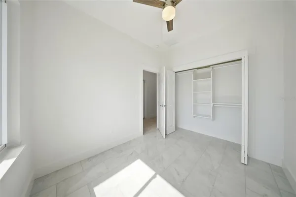 a view of an empty room with a window