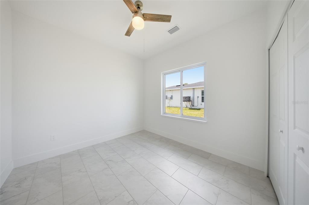 10458 Pendleton Avenue Englewood, FL 34224 - Photo 29 of 30 an empty room with windows