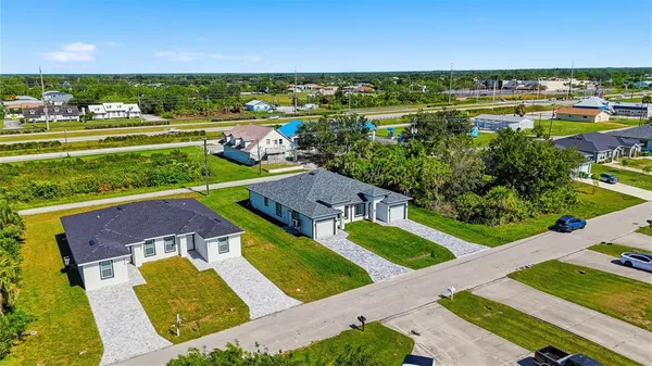 an aerial view of a house with a garden