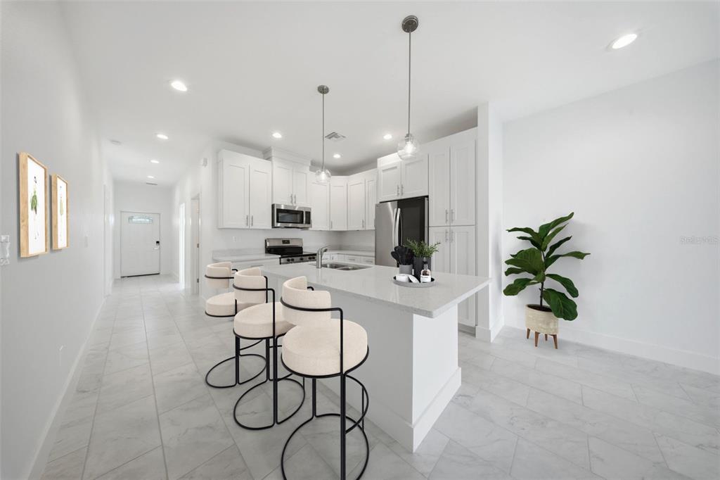 10458 Pendleton Avenue Englewood, FL 34224 - Photo 4 of 30 a view of kitchen with sink and refrigerator