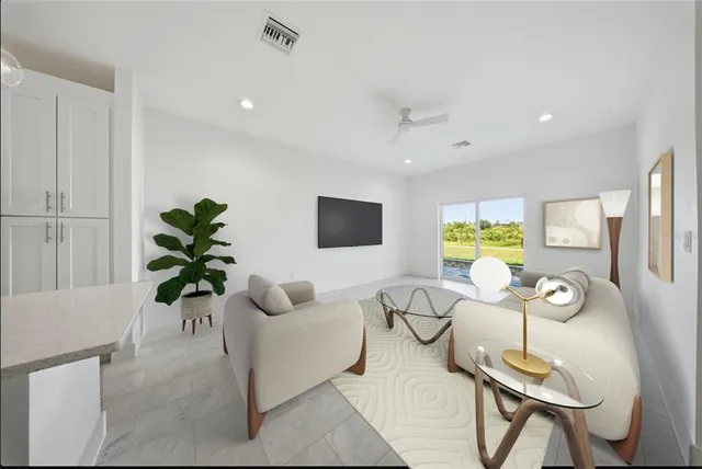 a living room with furniture and a potted plant