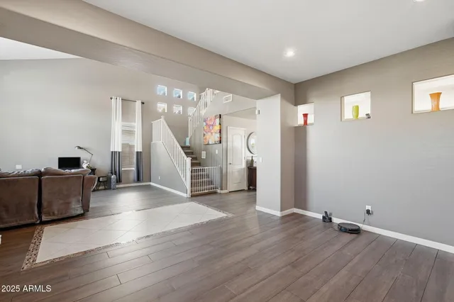 a large kitchen with kitchen island a sink table and chairs