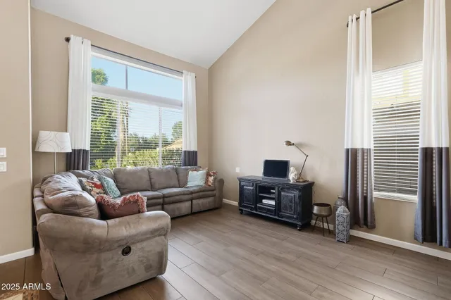 a view of workspace with furniture and wooden floor