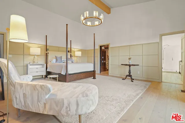 a bathroom with a bathtub sink and mirror