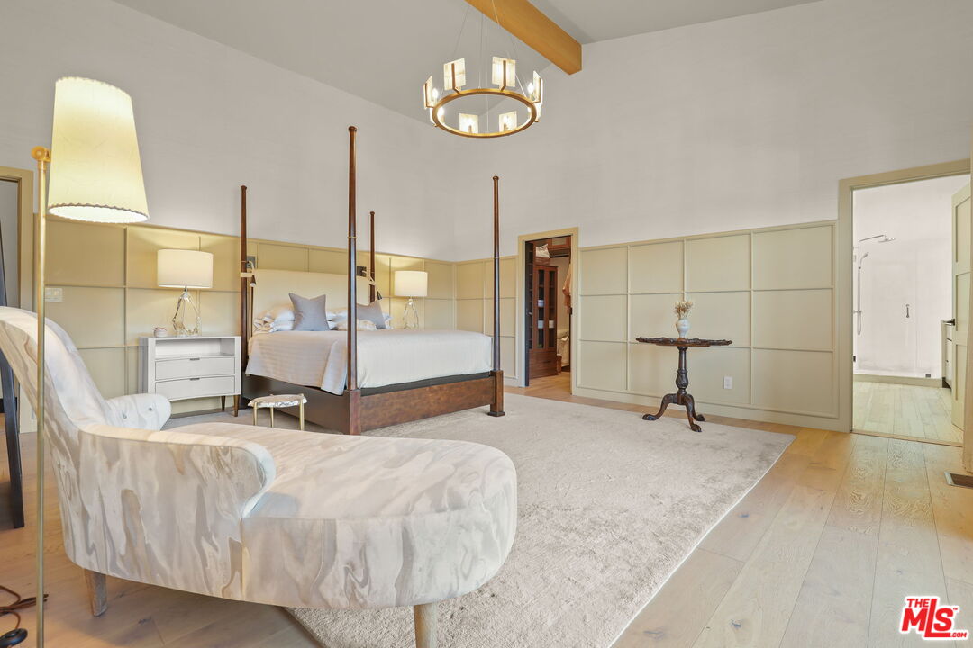 2835 Oak Point Drive Los Angeles, CA 90068 - Photo 20 of 50 a bedroom with a bed and wooden floor