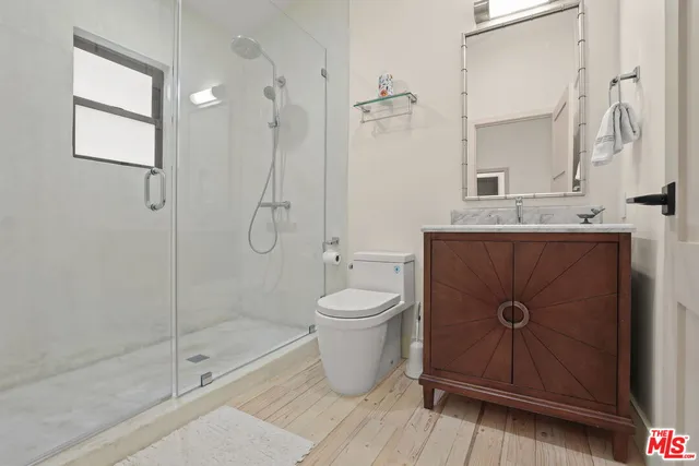 a workspace with furniture and a wooden floor