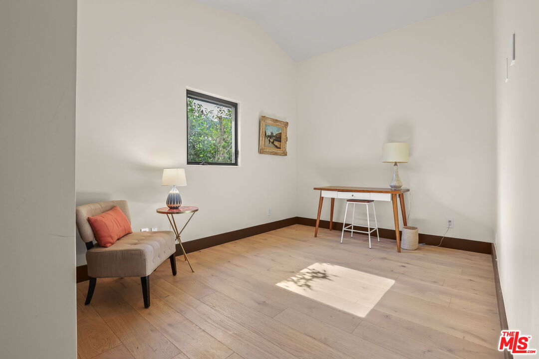 2835 Oak Point Drive Los Angeles, CA 90068 - Photo 26 of 50 a workspace with furniture and a wooden floor