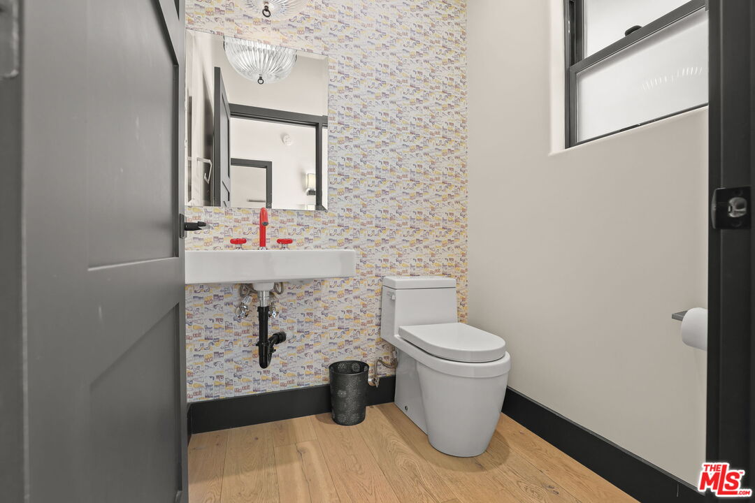 2835 Oak Point Drive Los Angeles, CA 90068 - Photo 30 of 50 a bathroom with a toilet and a mirror