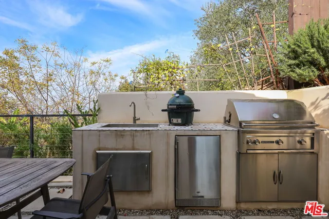 a view of a two chairs in the balcony