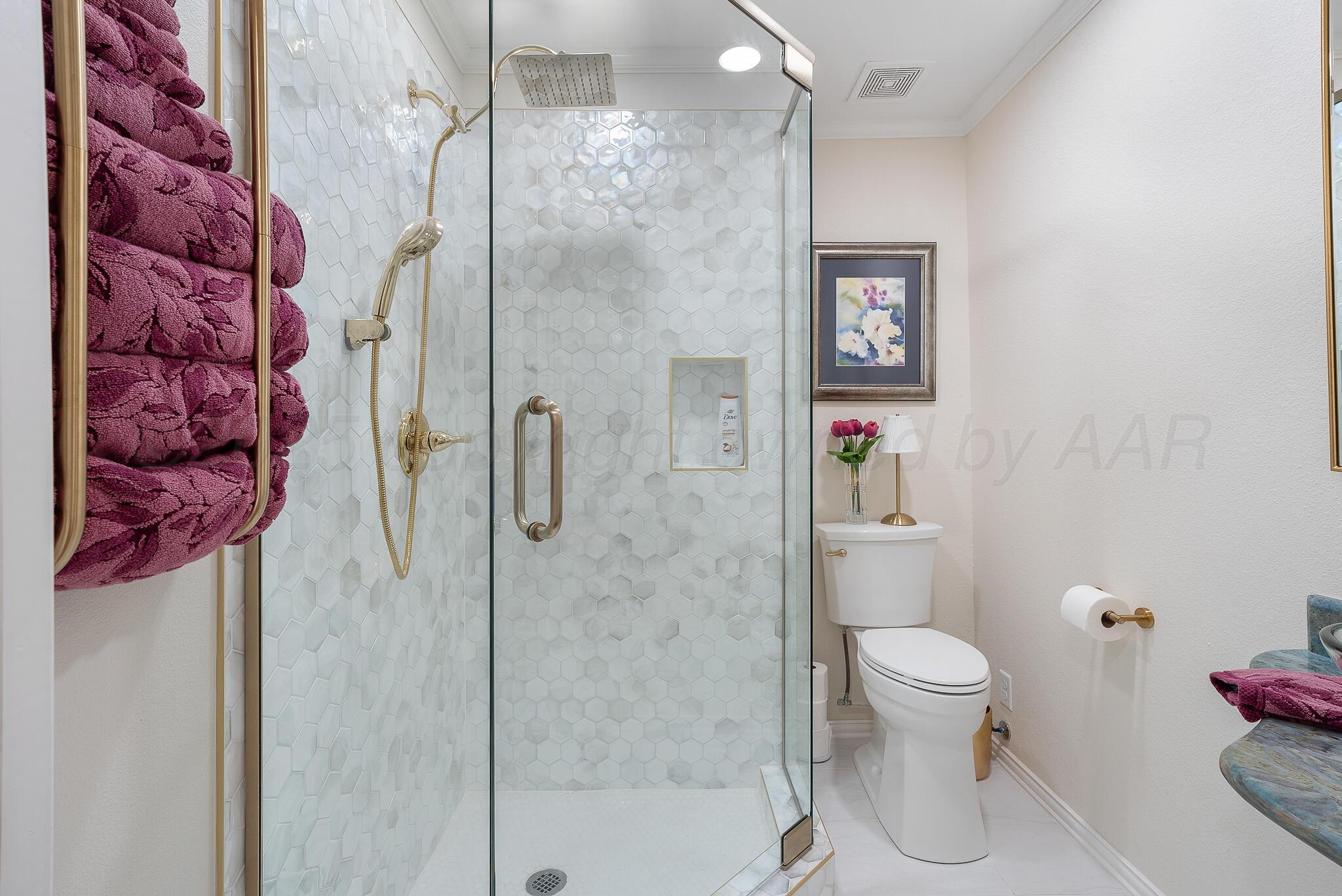 110 Caprock Lane Amarillo, TX 79118 - Photo 15 of 46 a bathroom with a shower and toilet
