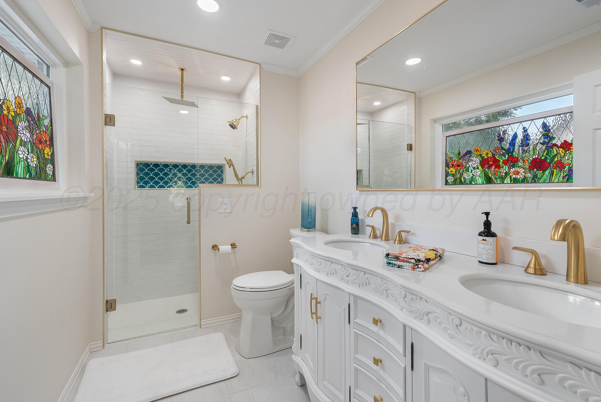 110 Caprock Lane Amarillo, TX 79118 - Photo 18 of 46 a bathroom with a double vanity sink mirror and toilet