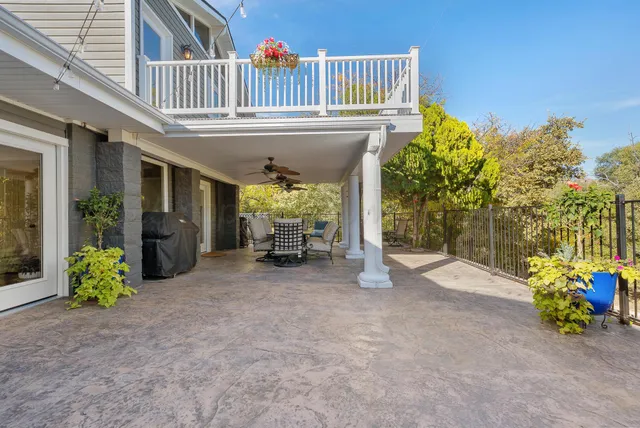 a view of a house with porch and furniture