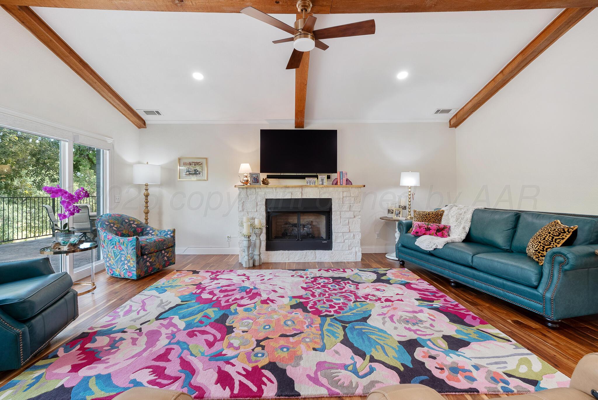 110 Caprock Lane Amarillo, TX 79118 - Photo 7 of 46 a living room with furniture and a flat screen tv