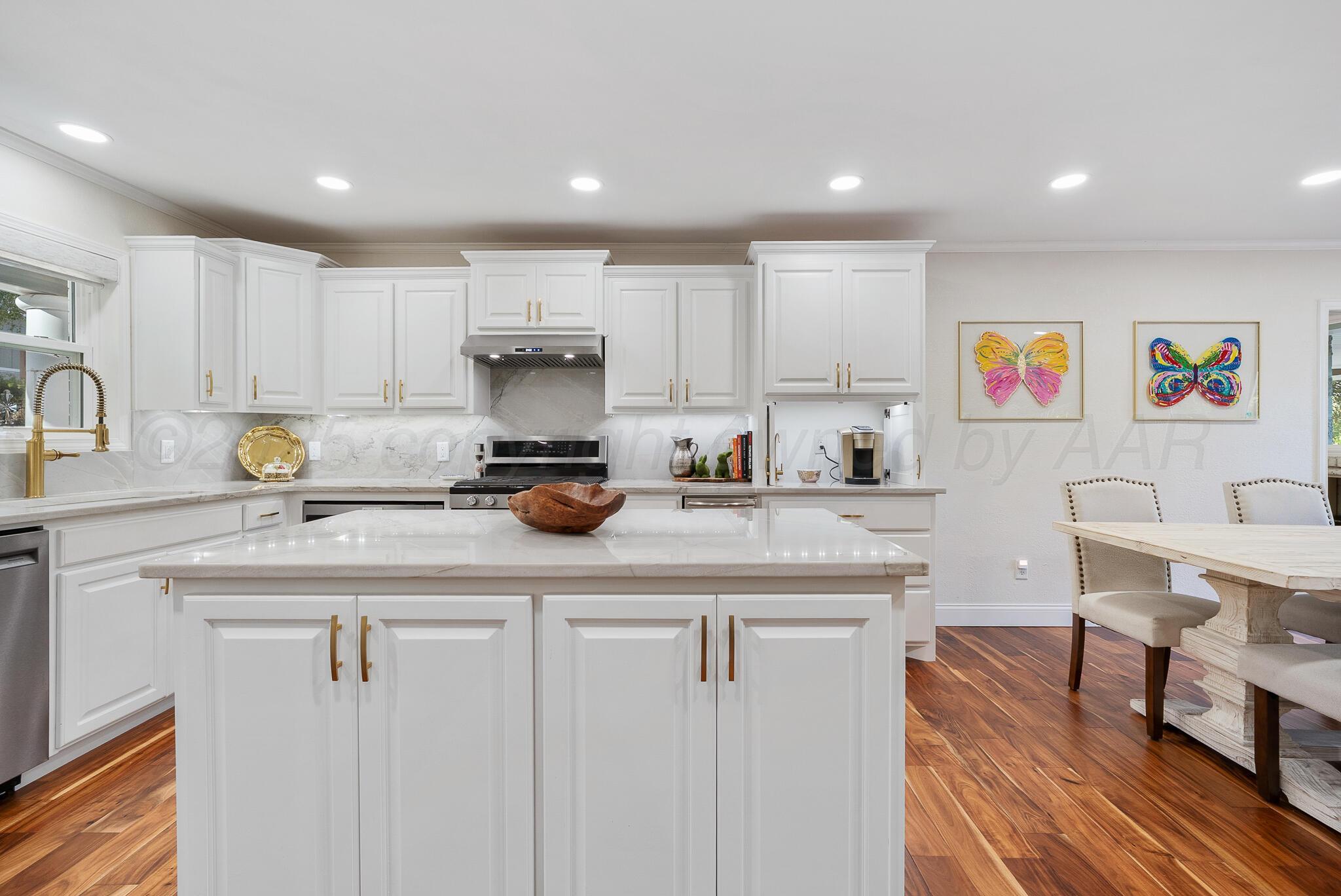 110 Caprock Lane Amarillo, TX 79118 - Photo 10 of 46 a kitchen with cabinets a sink and appliances