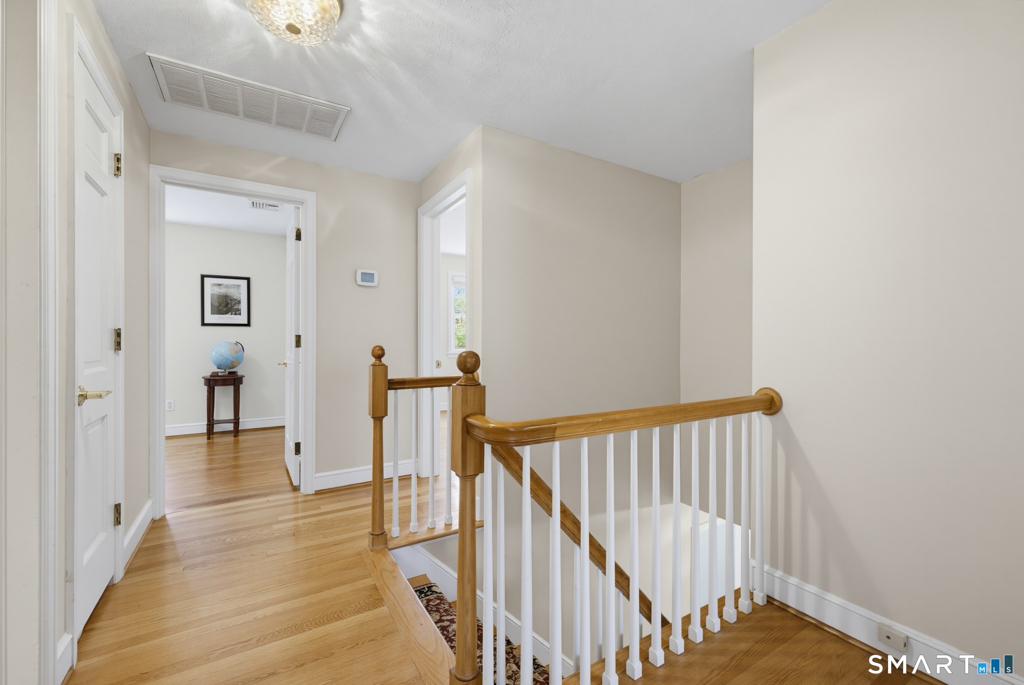 224 Spring Street Manchester, CT 06040 - Photo 16 of 39 a view of a hallway with a hardwood floor