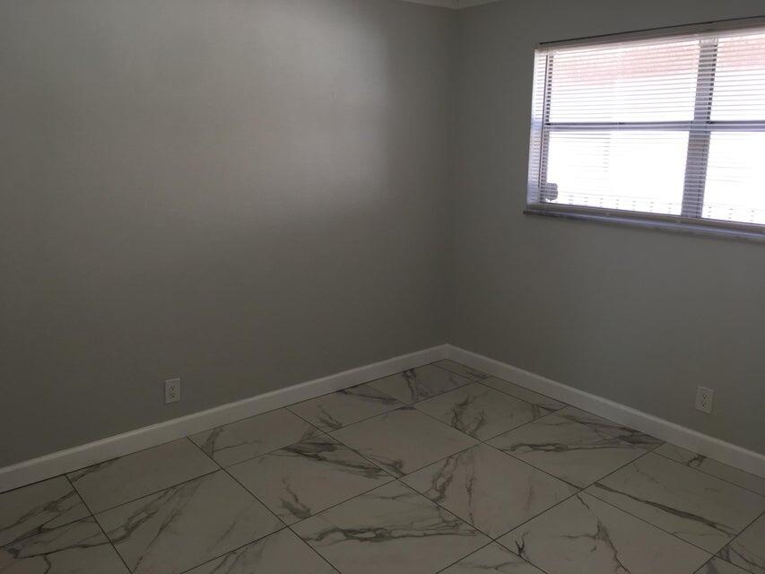 450 Southwest 2nd Avenue, Unit 2080 Boca Raton, FL 33432 - Photo 11 of 14 an empty room with a window