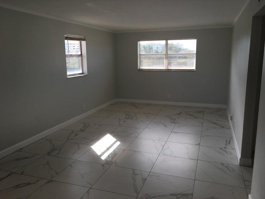 450 Southwest 2nd Avenue, Unit 2080 Boca Raton, FL 33432 - Photo 2 of 14 a view of an empty room and window