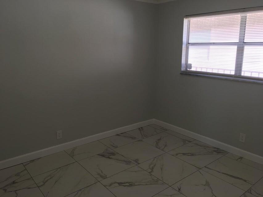 450 Southwest 2nd Avenue, Unit 2080 Boca Raton, FL 33432 - Photo 10 of 14 an empty room with a window