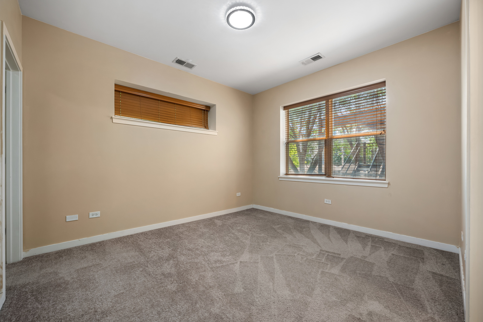 907 South Lytle Street, Unit 201 Chicago, IL 60607 - Photo 15 of 28 an empty room with windows
