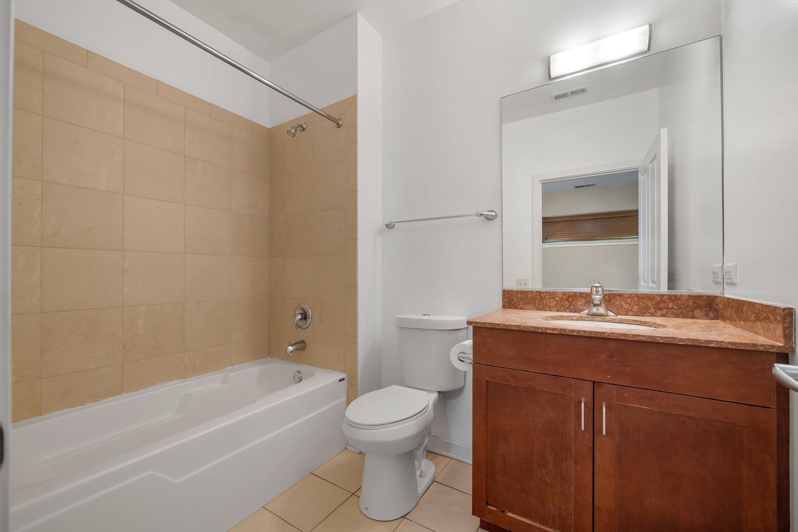 907 South Lytle Street, Unit 201 Chicago, IL 60607 - Photo 18 of 28 a bathroom with a granite countertop toilet a sink and a bathtub