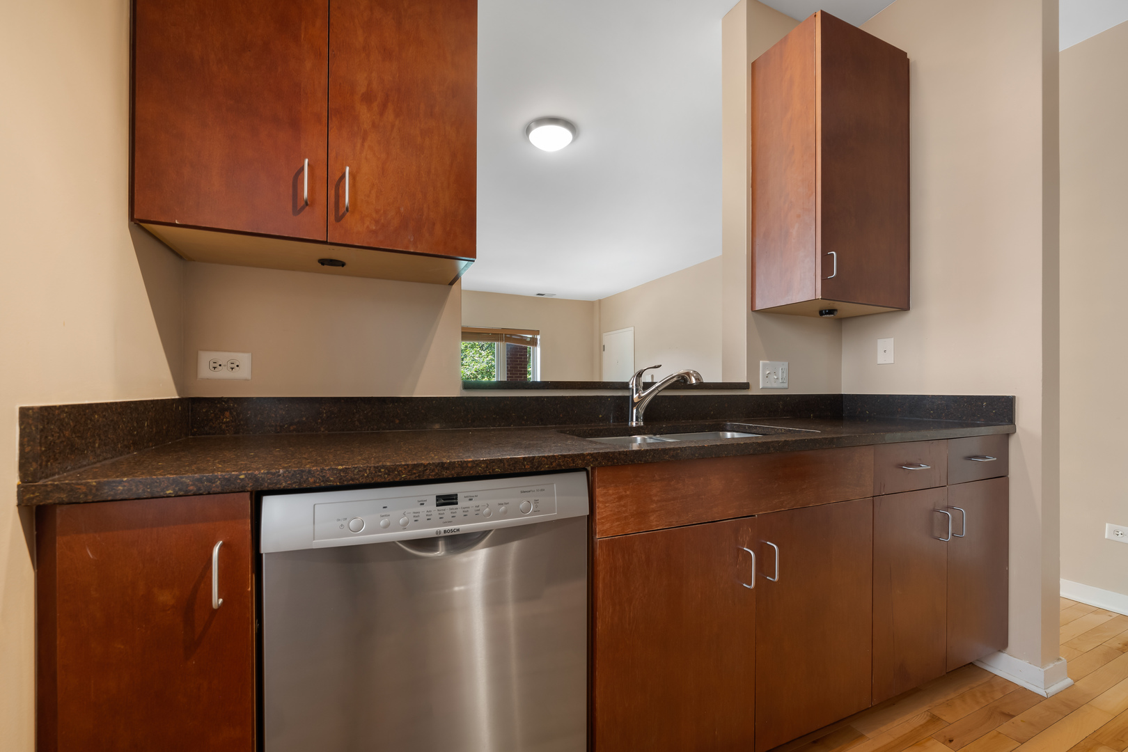 907 South Lytle Street, Unit 201 Chicago, IL 60607 - Photo 10 of 28 a kitchen with a sink a refrigerator and cabinets