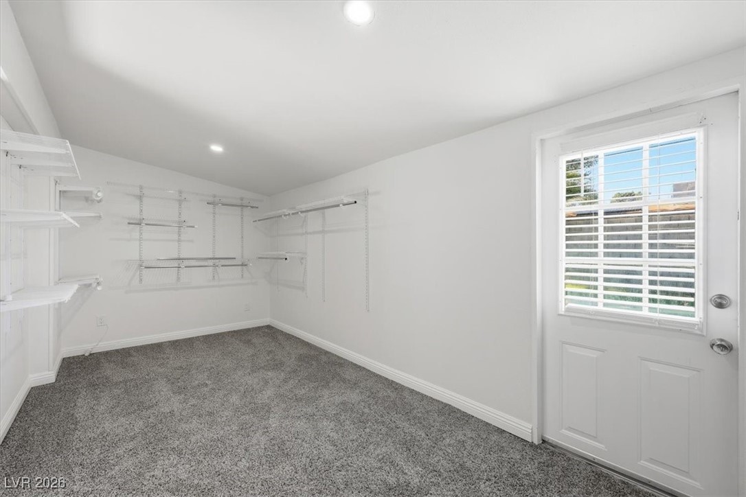 2337 Michael Way Las Vegas, NV 89108 - Photo 18 of 27 Walk in closet featuring lofted ceiling and private pool access.