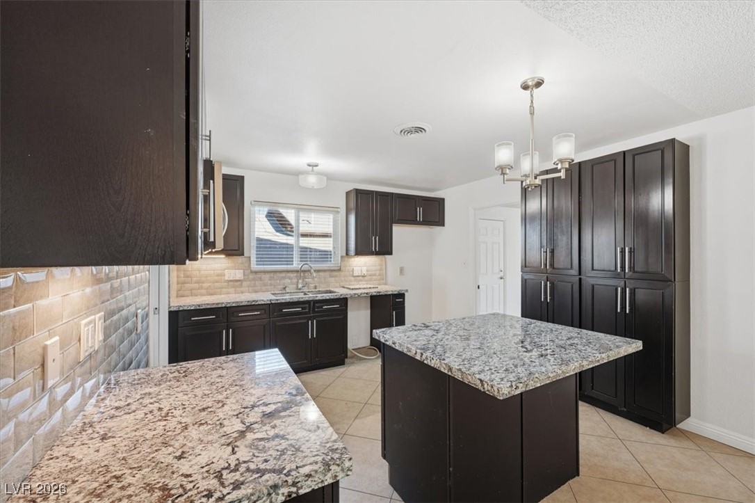 2337 Michael Way Las Vegas, NV 89108 - Photo 9 of 27 Thru the kitchen past the island...