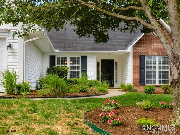 25 Forest Berry Road Fletcher, NC 28732 - Photo 3 of 24 a front view of a house with a yard and potted plants