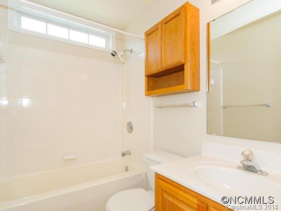 25 Forest Berry Road Fletcher, NC 28732 - Photo 22 of 24 a bathroom with a sink and a bathtub
