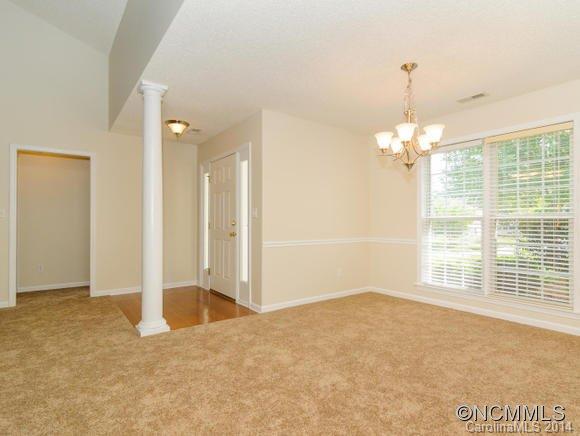 25 Forest Berry Road Fletcher, NC 28732 - Photo 6 of 24 an empty room with chandelier fan and windows