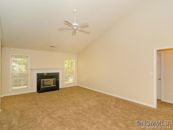 25 Forest Berry Road Fletcher, NC 28732 - Photo 8 of 24 a view of an empty room with a fireplace and a window
