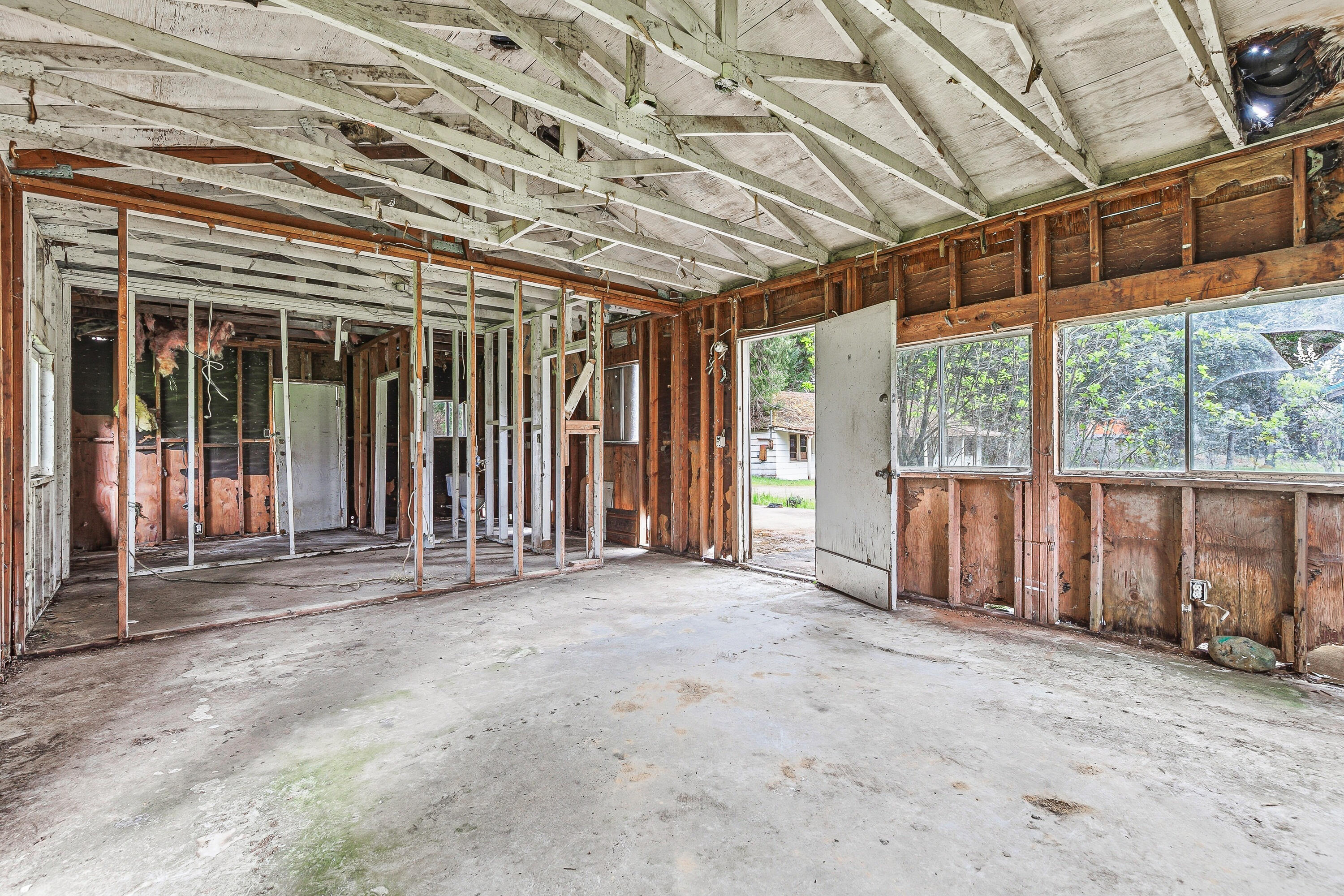 159 Bloom Road Wolf Creek, OR 97497 - Photo 22 of 38 a view of a room with wooden walls and roof