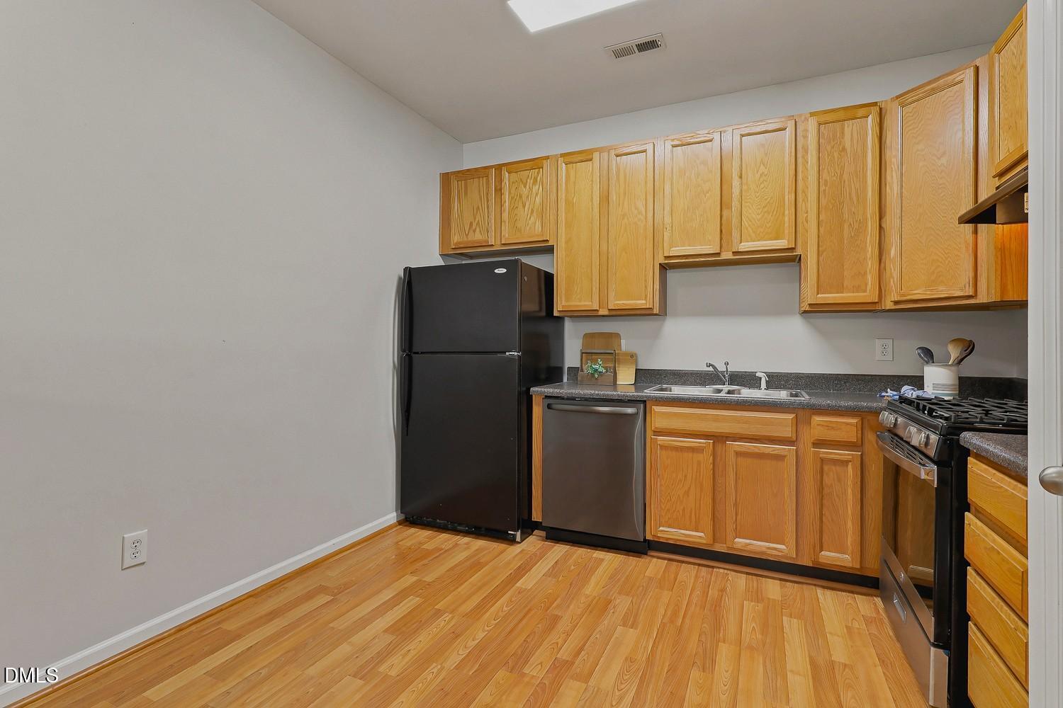 8620 Neuse Club Lane, Unit 107 Raleigh, NC 27616 - Photo 15 of 33 015-027-Kitchen-1500x1000