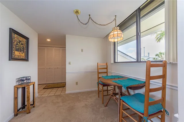 a view of a livingroom with furniture and window