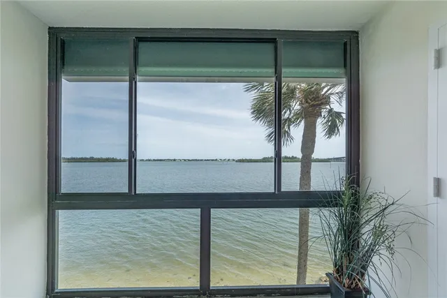 a bedroom with a bed and a lamp