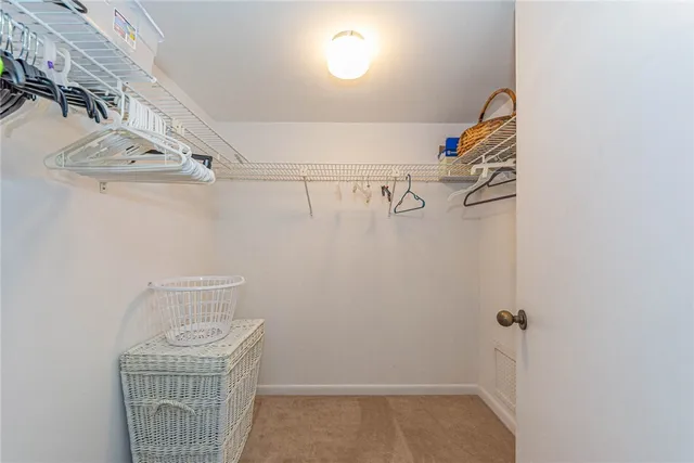 a bathroom with a shower a toilet and a sink