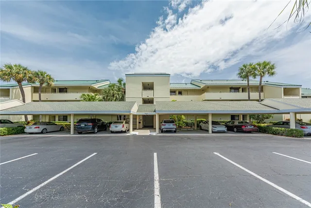 a group of cars parked in front of a building