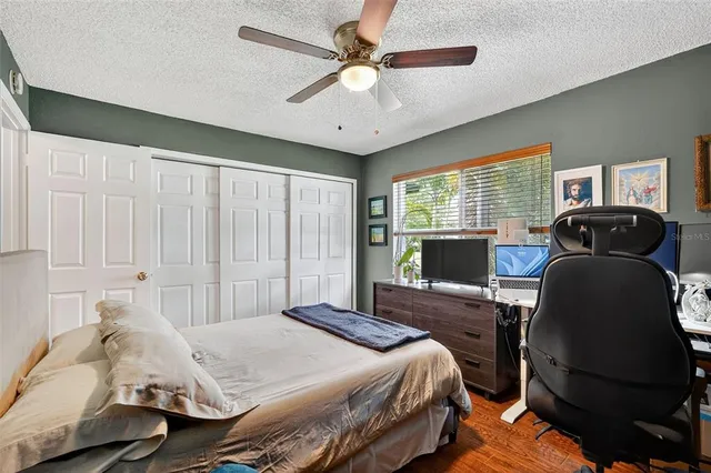 a bedroom with a bed and window