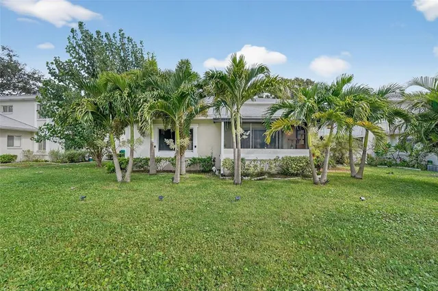 a view of a house with a backyard