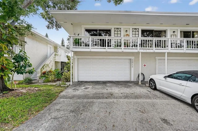 a view of a car park in front of house